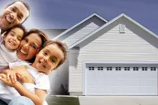 Family in front of a garage